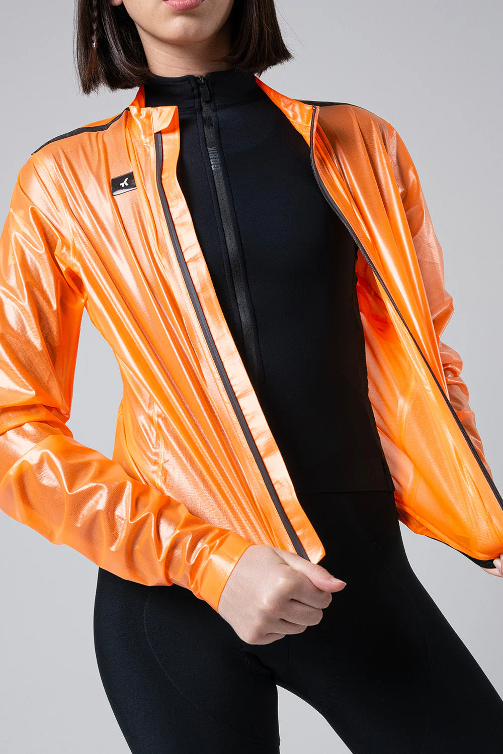 10-05-009-002-lightweight-rain-jacket-pluvia-2-0-women-blazing-orange-02_a7239374-19cf-4acb-aee6-0d4235c426dc.webp